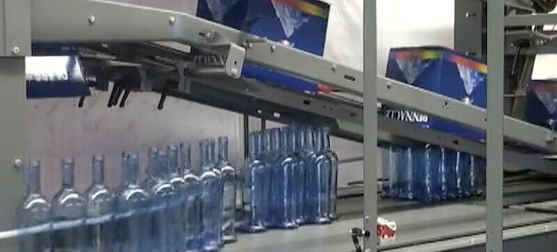 Uncasing Distilled Spirits Bottles